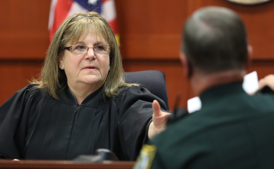 Judge Debra Nelson receives the verdict from a deputy. Zimmerman was cleared of all charges; he faced the possibility of being charged with manslaughter or second-degree murder.