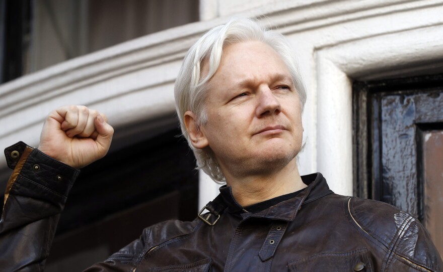 In this Friday May 19, 2017 file photo, Julian Assange greets supporters outside the Ecuadorian embassy in London. Britain's High Court on Wednesday July 7, 2021, has granted the U.S. government permission to appeal a decision that WikiLeaks founder Julian Assange cannot be sent to the United States to face espionage charges.