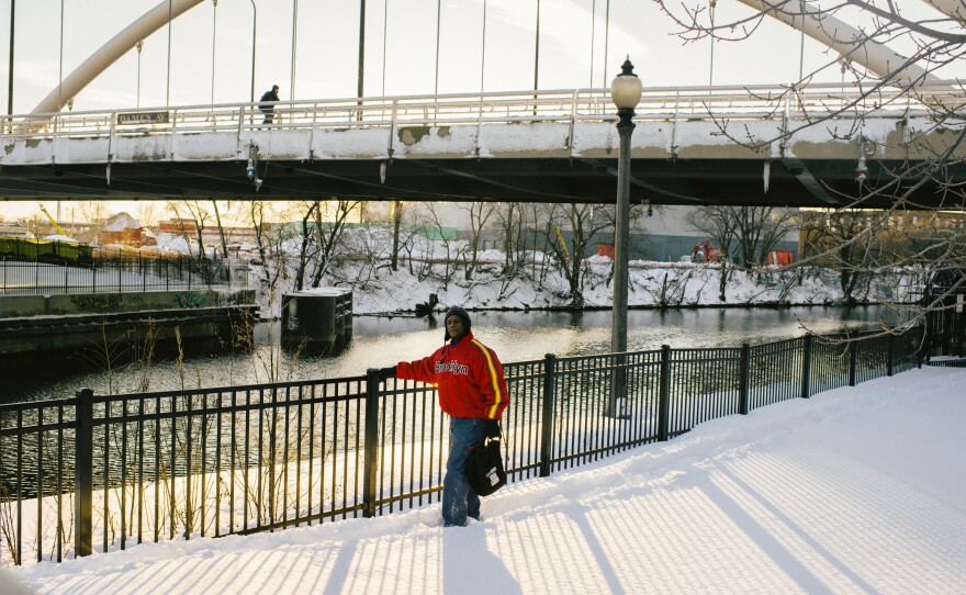 J.L. Gross walks along a river pathway near the Lathrop Homes. He has lived in the development for 27 years and cherishes Lathrop because "it gives us a sense of community to live here. In a project setting you generally don't have that."