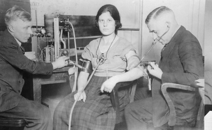 John Larson (left) and August Vollmer interrogate an unknown Berkeley undergraduate in 1921 or 1922 when Larson was conducting his early lie detector experiments by searching for thieves at Berkeley sororities.