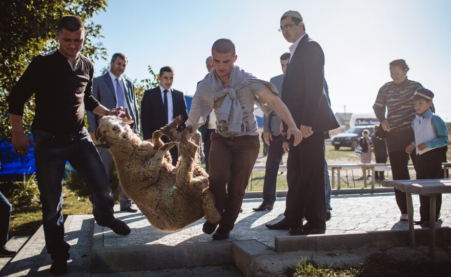 Konstantin Voyko, a Russian-appointed official, was responsible for bringing a live sheep to a religious celebration in the Tatar community. But many Tatars are suspicious of Russian rule.