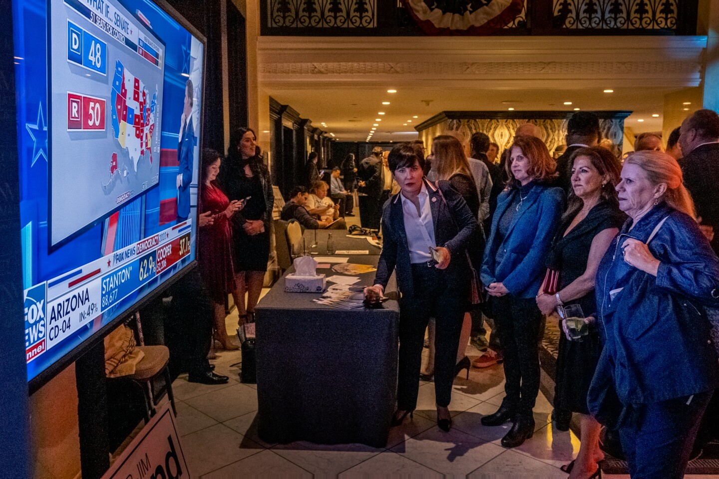Attendees of the Republican Party of San Diego County election watch party at the U.S. Grant Hotel closely monitor the national election results, San Diego, Nov, 8, 2022.
