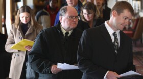 Job applicants enter the 'Denver Hires Job Fair' on December 5, 2011 in Denver, Colorado.