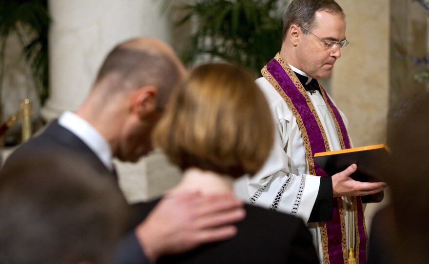 The Rev. Paul Scalia leads a prayer during a private ceremony for his father, Justice Antonin Scalia, on Friday in the Great Hall of the Supreme Court.