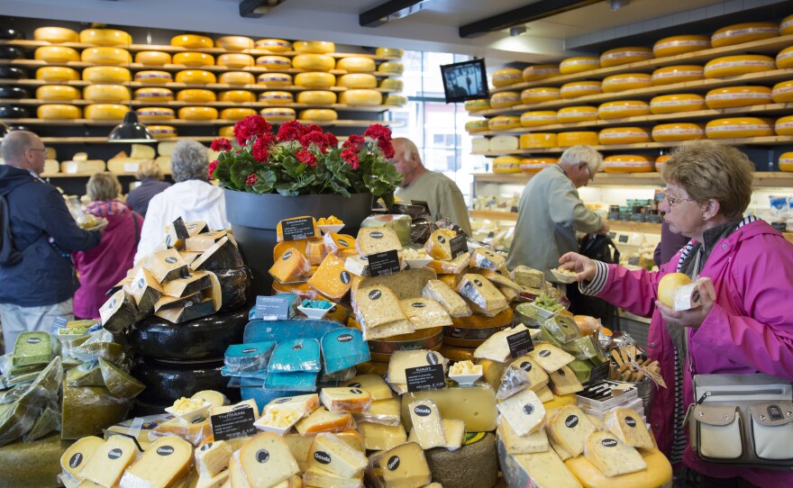 The European Union's highest court has ruled that a food's taste can't be copyrighted. Here, people shop for cheese in Gouda, Netherlands, in 2015.