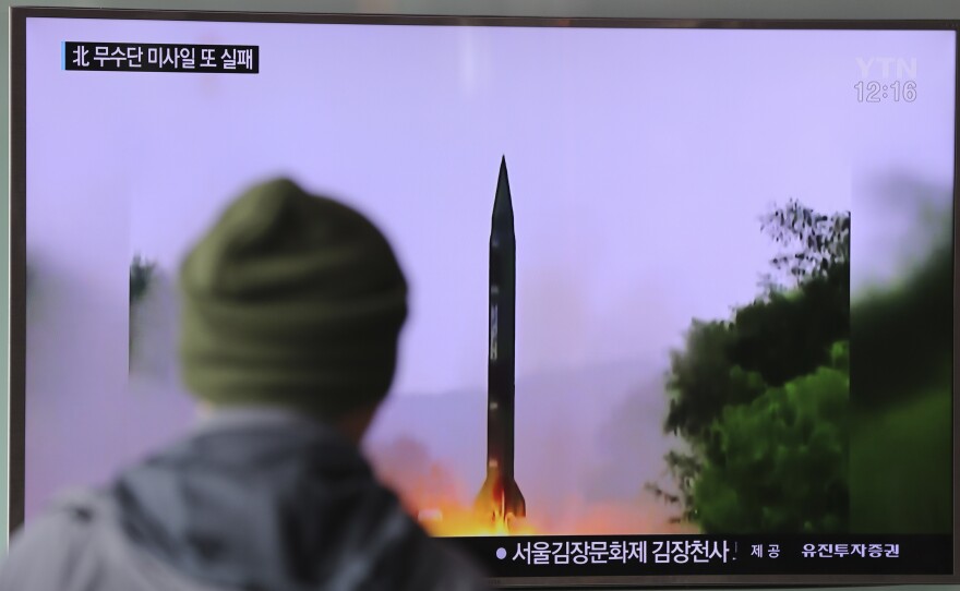A man watches a TV news program showing a file image of missile launch conducted by North Korea, at the Seoul Railway Station in Seoul, South Korea, on Oct. 20. The U.S. military said it detected a failed North Korean missile launch that day. The U.S. Strategic Command issued a statement late Wednesday saying it presumed the missile was a Musudan intermediate-range ballistic missile.