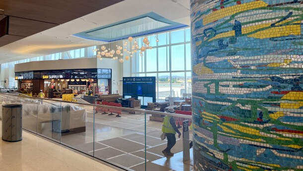 People walk around inside San Diego International Airport's New Terminal 1, Aug. 27, 2025.
