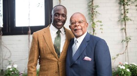 Host Henry Louis Gates, Jr. (right) with actor Michael K. Williams (left) while taping FINDING YOUR ROOTS.