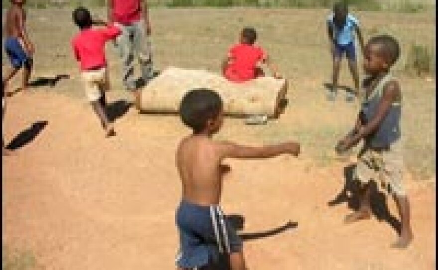 Children from Zolani township entertain themselves with the little they have.