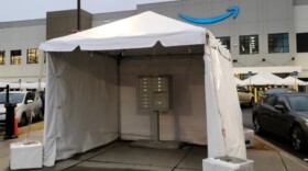 During last year's high-profile union vote, an Amazon-branded tent cloaks a mailbox outside the company's warehouse in Bessemer, Ala.
