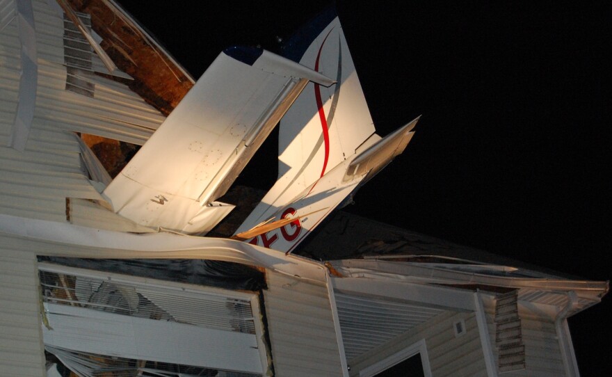 This photo from the Virginia State Police shows the tail of the small plane that crashed into the living room of an apartment in Herndon, Va., early Friday.