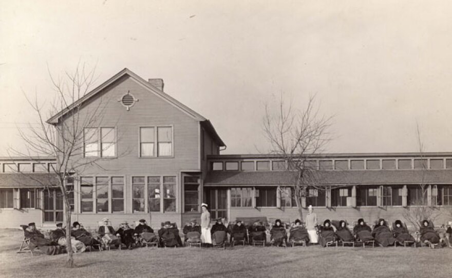 Patients take an open-air treatment on the lawn of Minneapolis City Hospital's Hopewell Hospital. This quarantine hospital and tuberculosis sanatorium operated from 1907-192 and was later renamed Parkview Sanatorium.