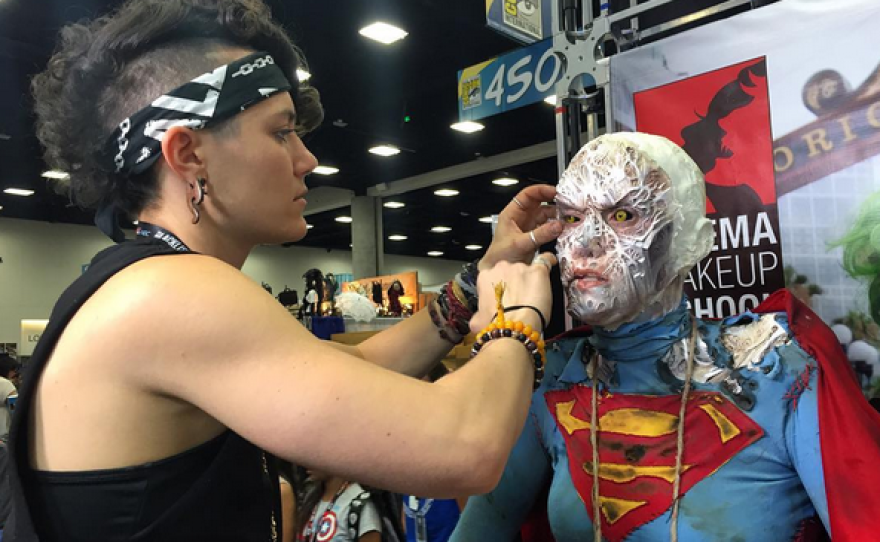Madison Burger applies makeup to Katie Kotulak at Comic-Con International, July 20, 2016.