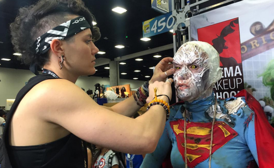 Madison Burger applies makeup to Katie Kotulak at Comic-Con International, July 20, 2016. 