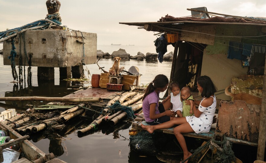 Sisters Joan (left) and Jossa Garcia (right), both teen mothers, are seen in their home in the Navotas fish port with their children, Angela and JM, respectively.