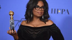 Oprah Winfrey poses in the press room with the Cecil B. DeMille Award at the 75th annual Golden Globe Awards at the Beverly Hilton Hotel in Beverly Hills, Calif. on Sunday, Jan. 7, 2018. 