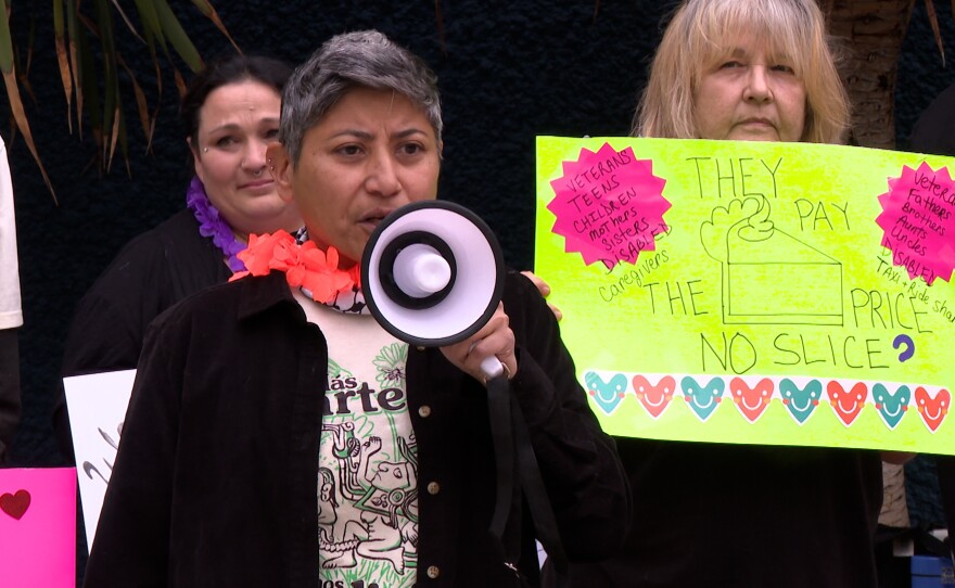 San Diego RV Residents Union member Frances Yasmeen-Motiwalla is shown speaking at a protest at Civic Center Plaza on February 10, 2026.