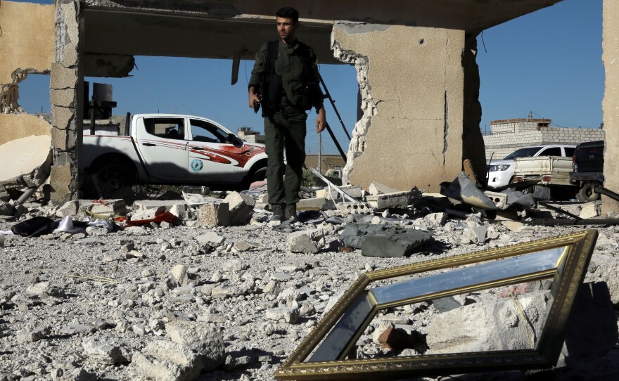 A member of the Kurdish internal security forces (known as the Asayish) inspects the Alaya prison in the northeastern Syrian city of Qamishli on April 22.