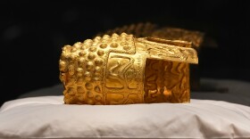 Dacian gold items, a 2,500-year-old helmet and wristbands, stolen from a museum in the Netherlands and then recovered by Dutch authorities, are presented during a press conference after being returned, at the National Museum of Romanian History, in Bucharest, Romania, Tuesday, April 21, 2026.