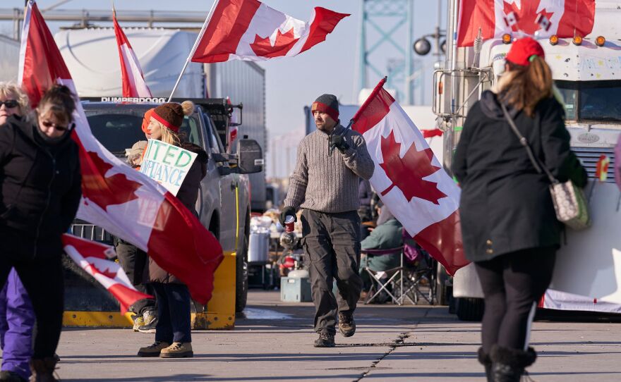 Protestors against COVID-19 vaccine mandates block the roadway at the Ambassador Bridge border crossing in Windsor, Ontario, Canada, on Wednesday.