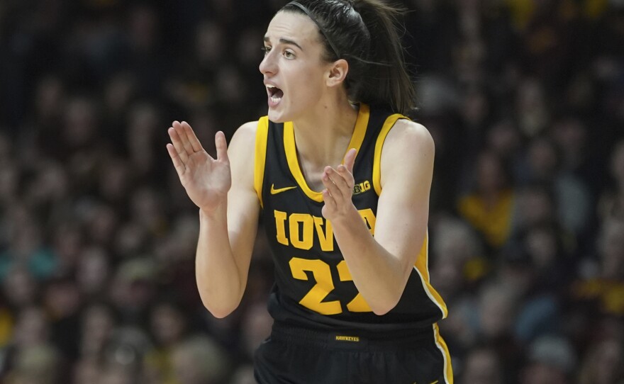 Iowa guard Caitlin Clark claps during the second half of a game against Minnesota on Wednesday in Minneapolis.