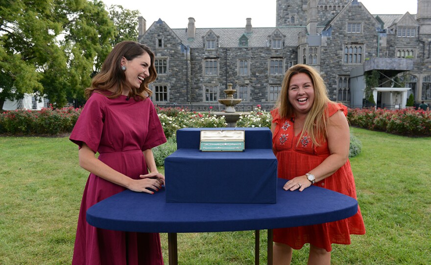 Katherine Van Dell (left) appraises a diamond and platinum convertible necklace, ca. 1925, in Sands Point, NY.