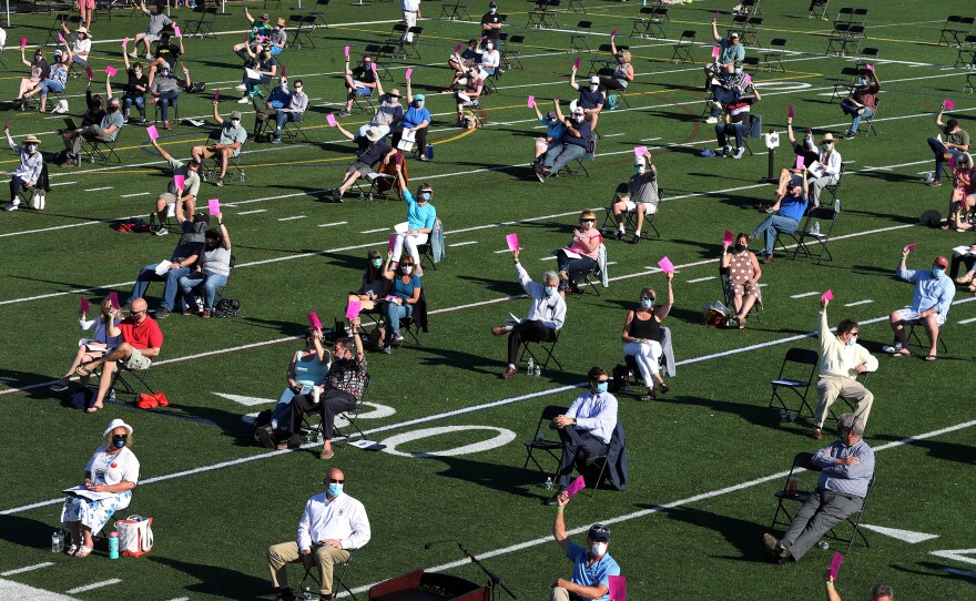 The annual town meeting in North Andover, Mass., which dates back to 1646, was held outside on June 16 on a high school football field to help keep participants a safe distance from each other.