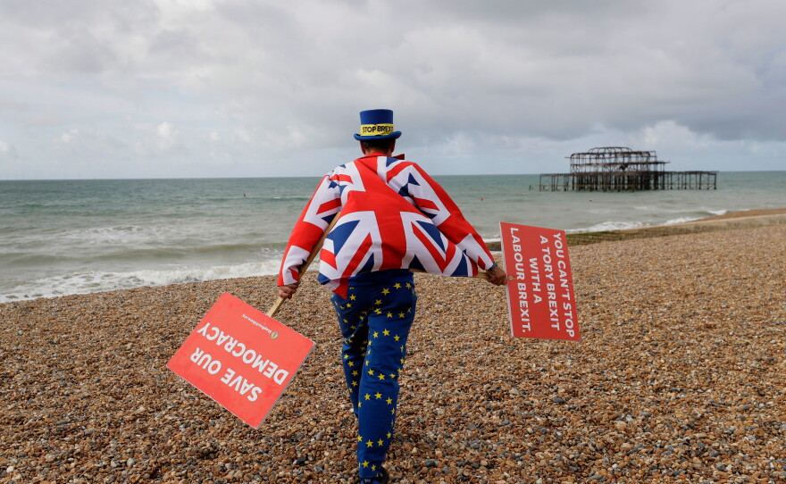 Anti Brexit campaigner Steve Bray walks on the beach to pose for a photograph during the Labour Party Conference at the Brighton Centre in Brighton, England, Monday, Sept. 23, 2019.