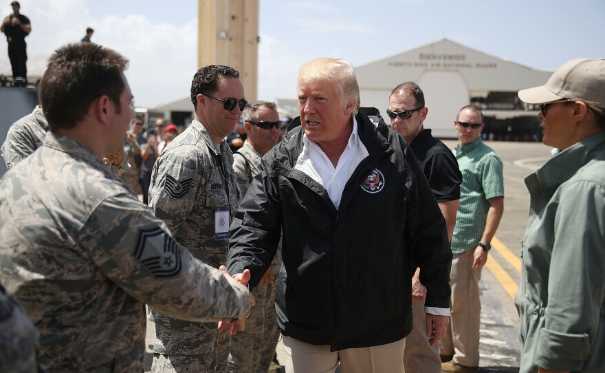 President Trump greets members of the U.S Air Force at the Muniz Air National Guard Base in Carolina, Puerto Rico. Trump visited the island on Tuesday in the wake of Hurricane Maria.