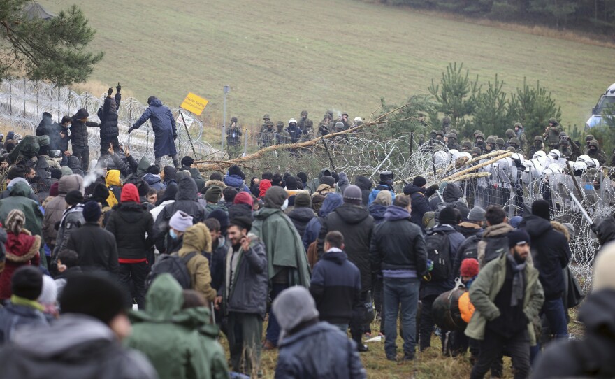 Migrants from the Middle East and elsewhere gather at the Belarus-Poland border near Grodno, Belarus, on Monday.