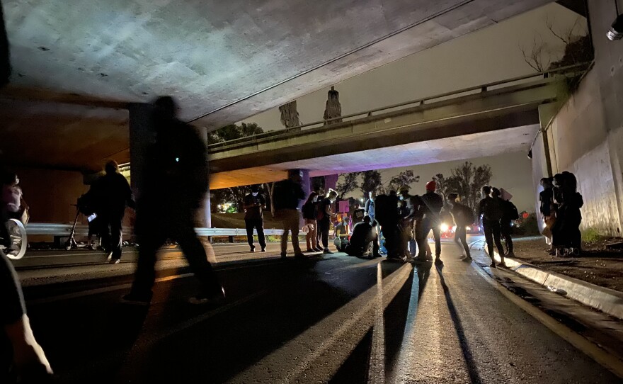 The ANA/C San Diego Regional Task Force responds to a woman who fell during a demonstration for social justice in the city of San Diego, June 4, 2020.