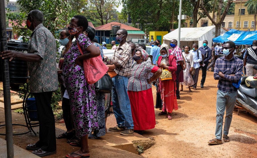 People queue to receive COVID-19 vaccines at a health center in Kampala, Uganda, after weeks of no supply. In Uganda, only 2.2% of the population had received one dose of a vaccine as of August 15