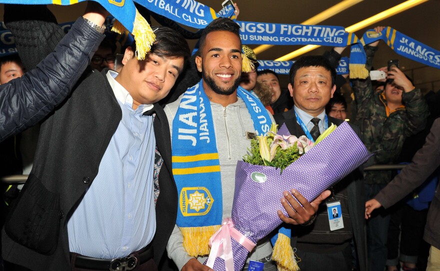 Brazilian midfielder Alex Teixeira is welcomed to China on Feb. 13 after signing a four-year contract with Chinese Super League club Jiangsu Suning.