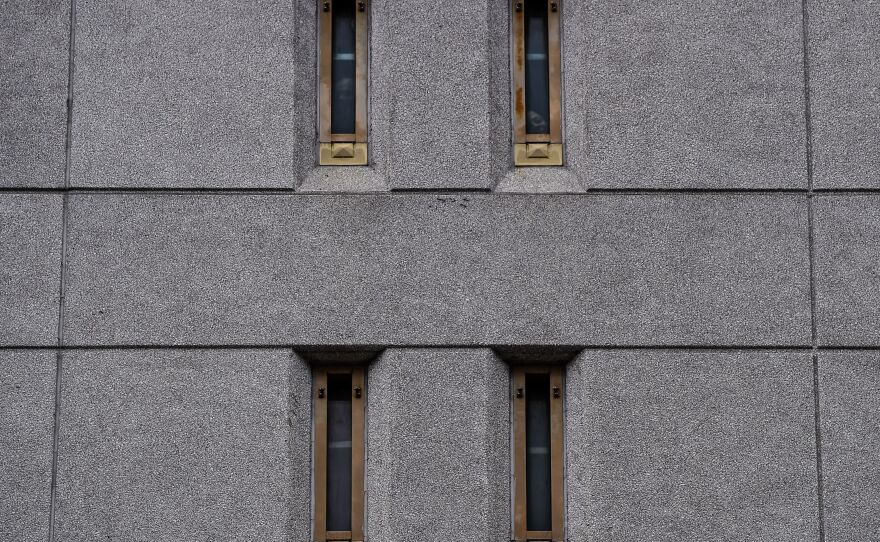 Prisoners look out of their windows at the federal detention center in downtown Miami on June 12, 2020.