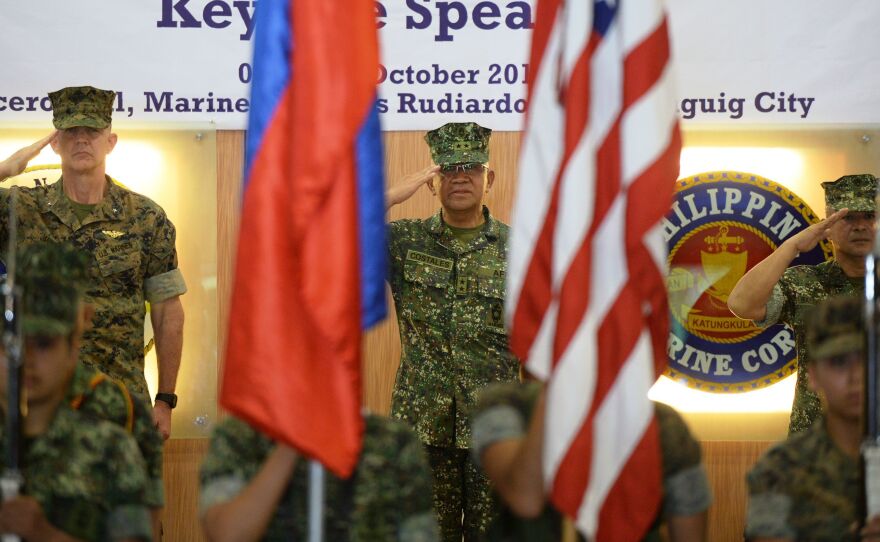 U.S. Marines Brig. Gen. John Jansen (left), Philippines marines Maj. Gen. Andre Costales (center) and Brig. Gen. Maximo Ballesteros salute during the opening ceremony of the Amphibious Landing Exercise in Manila on Tuesday. The Philippines and the U.S. launched war games on October 4 against the backdrop of the unusual threat of U.S. forces being ejected from the Southeast Asian nation.