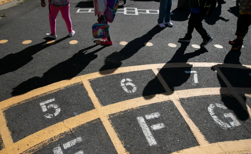 First-grade students walk to their classroom at the start of the day during summer session at Laurel Elementary in Oakland on June 11, 2021.