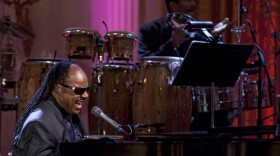 A photo of Stevie Wonder performing live at the White House on February 25, 2009. This special showcases an evening with President and Mrs. Obama at the White House in honor of musician Stevie Wonder's receipt of the Library of Congress Gershwin Prize for Popular Song.