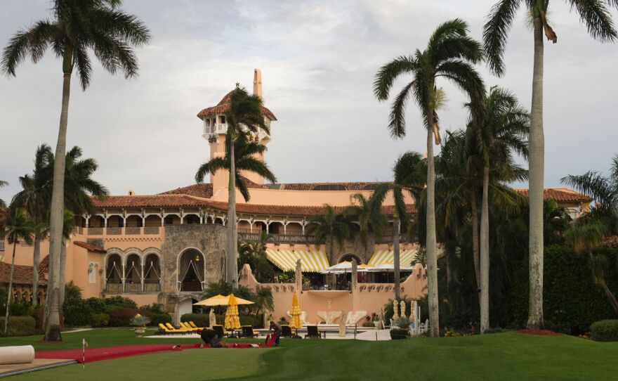 Workers lay out the red carpet at Mar-a-Lago Club in Palm Beach, Fla., on Dec. 30, 2016.