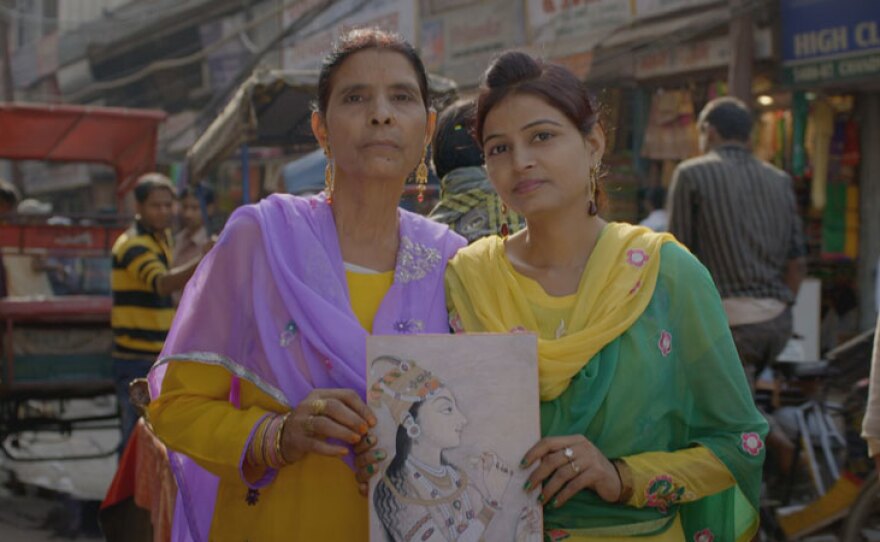 Contributors with a drawing of Empress Nur Jahan.