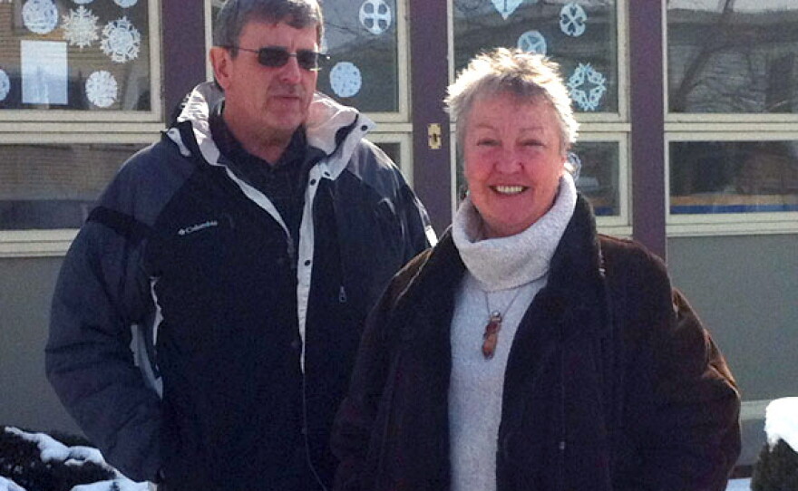 Terry Tatro and Irene Clarke stand in front of the People's United Bank branch on Main Street in Alburgh, Vt. The two feared that the bank's closing would leave a gaping hole in their community.