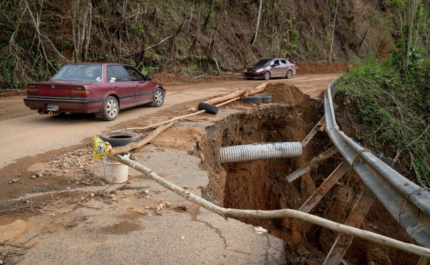 This damaged road in Maricao forces drivers to slow down almost one month after Hurricane Maria tore through Puerto Rico.
