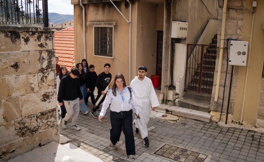 Youth from the Maronite church in Jezzine celebrate Lazarus Saturday, the day before Palm Sunday, by going from house to house and performing the story of Lazarus rising from the dead.