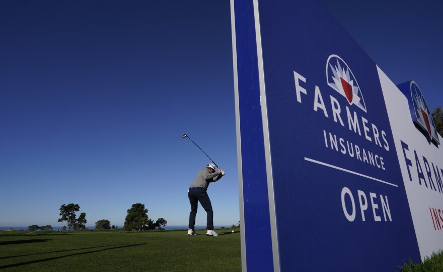 Zac Blair hits his tee shot on the 10th hole of the North Course at Torrey Pines during the first round of the Farmers Insurance Open golf tournament, Wednesday, Jan. 25, 2023, in San Diego.