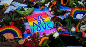 People leave flowers and notes outside the Brandenburg Gate in support of LGBTQ+ after a car rammed into a crowd at the Pride March in Berlin, Sunday, July 26, 2026.