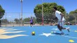 Khalid Hassan dribbles a soccer ball at Colina Del Sol Park's basketball courts, July 10, 2025.