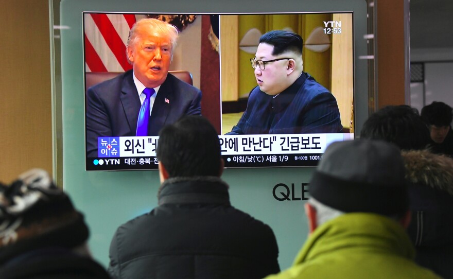 South Koreans at a railway station in Seoul watch a news report showing President Trump and North Korean leader Kim Jong Un on March 9. Trump agreed the day before to a historic first meeting with Kim.