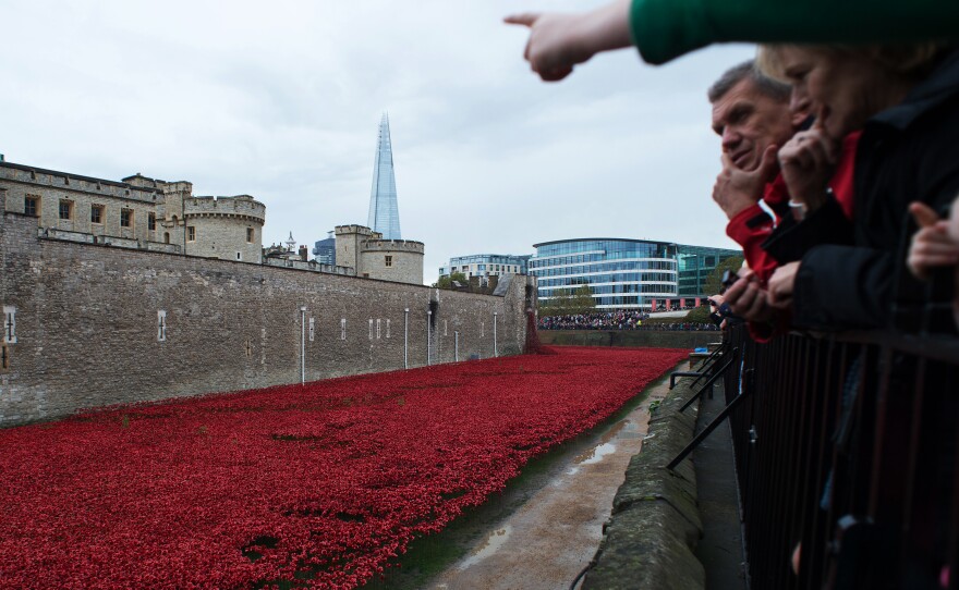 People look at the almost complete ceramic poppy art installation on Nov. 2.
