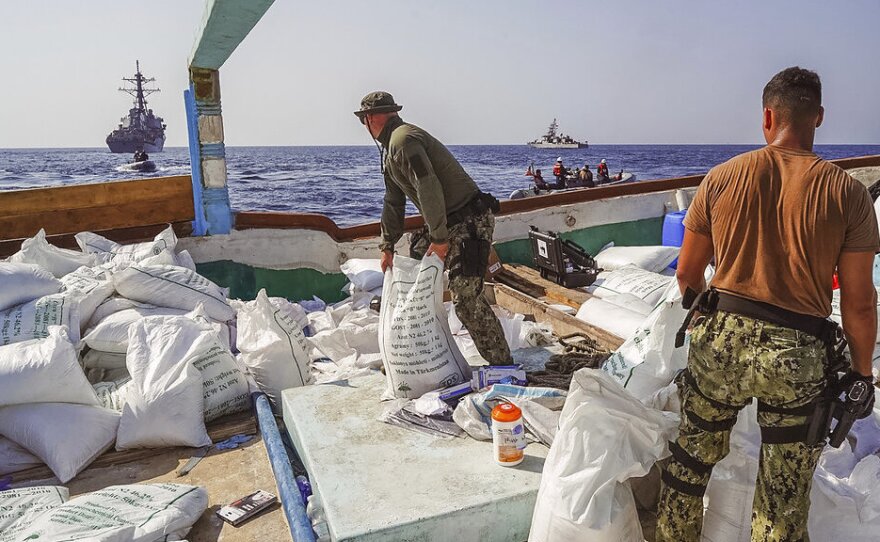 Sailors inventory urea and ammonium perchlorate found on a dhow intercepted in the Gulf of Oman. The U.S. Navy says it found 70 tons of a missile fuel component hidden among bags of fertilizer aboard a ship bound to Yemen from Iran.