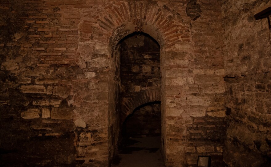 Left: Condensation can be seen on the stone walls in a section of a Byzantine substructure in Istanbul. Right: An archway in a section of a Byzantine substructure excavated by the owner of a carpet shop.