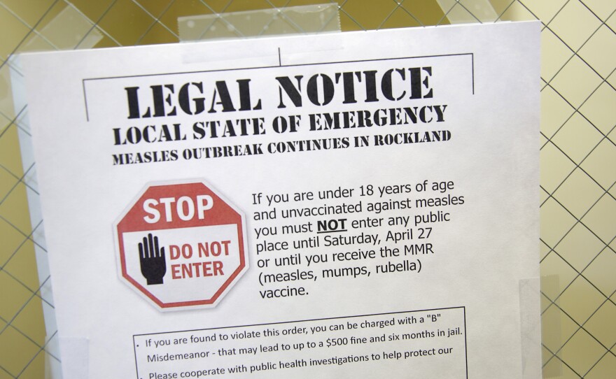 A sign explaining the local state of emergency because of a measles outbreak at the Rockland County Health Department in Pomona, N.Y.